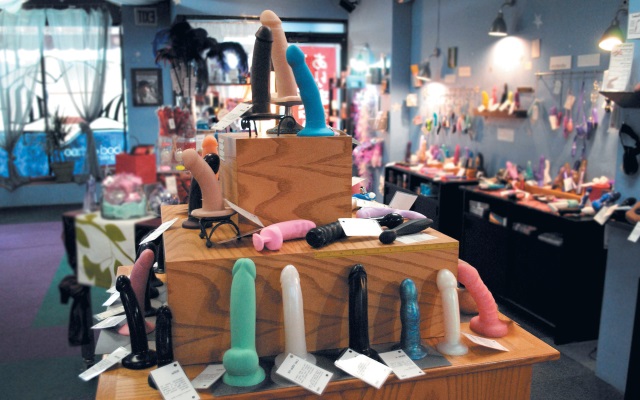 Sex toy store Well-lit sex toy store with bright dildos and other sex toys on display